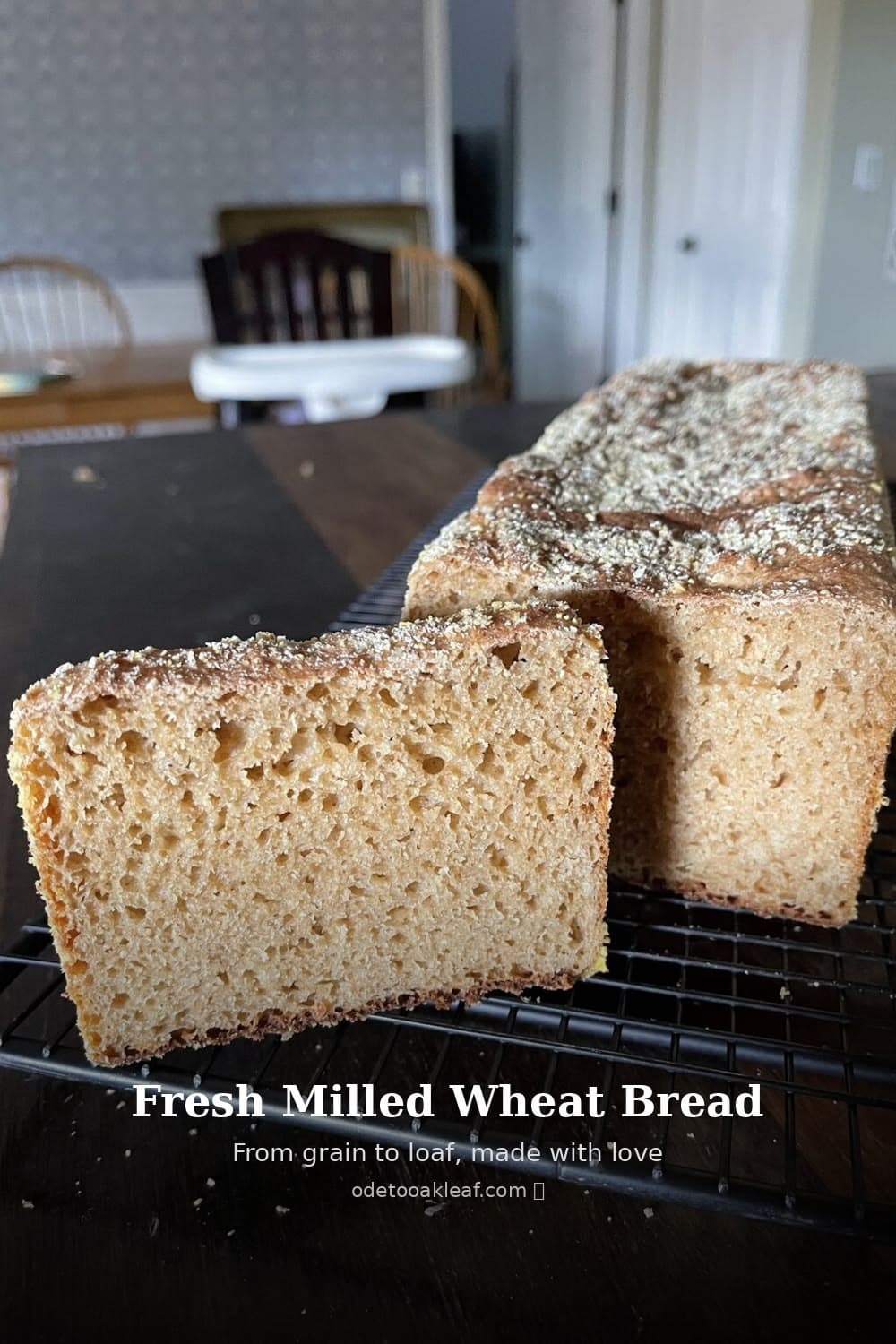 A sliced whole-wheat loaf on a cooling rack, with the words “Fresh Milled Wheat Bread.”